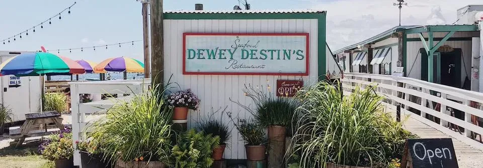 Exterior of Dewey Destin’s original seafood restaurant on Calhoun Avenue beside the bay
