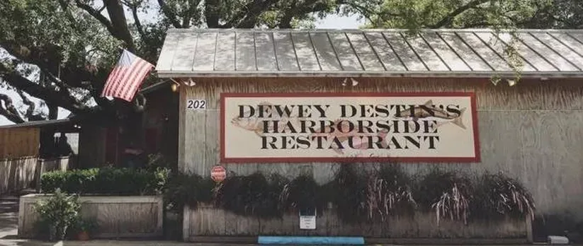 Dewey Destin’s Harborside Restaurant exterior and sign at 202 Harbor Boulevard.