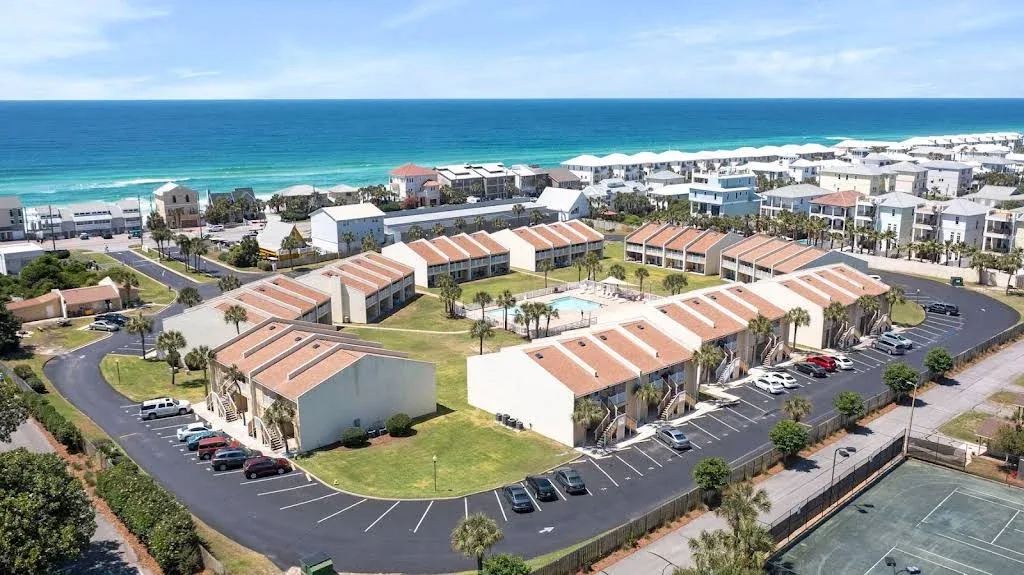 Aerial view of Seacove condominium community and nearby Gulf beach