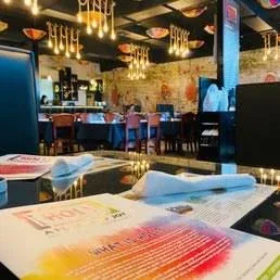 Dining room and table settings at Holi Indian Kitchen in Miramar Beach.