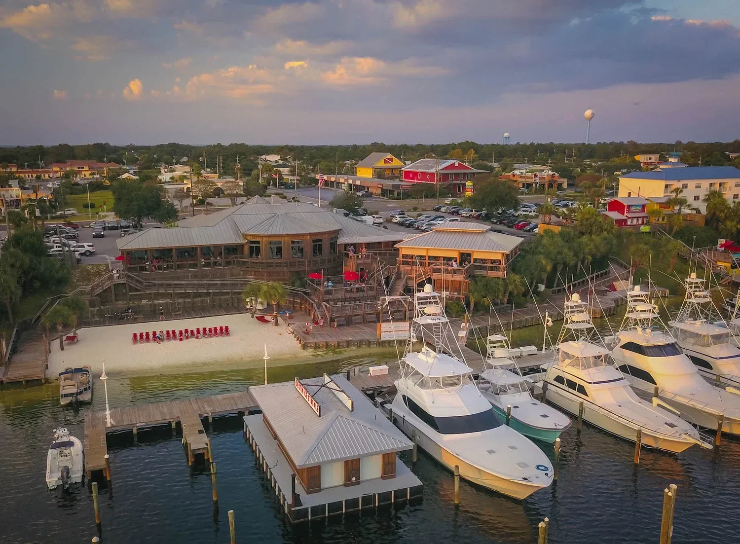 Aerial view of Boshamps Seafood and Oyster House and its docks on Destin Harbor.
