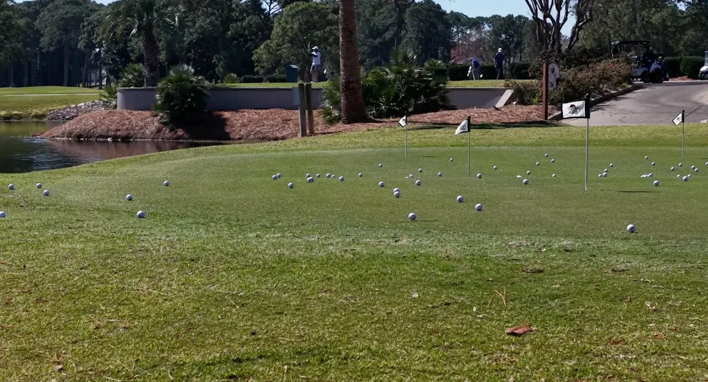 Practice green and golf course at Emerald Bay Golf Club