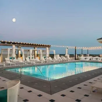 Hotel Effie’s Ara rooftop pool and lounge at dusk.