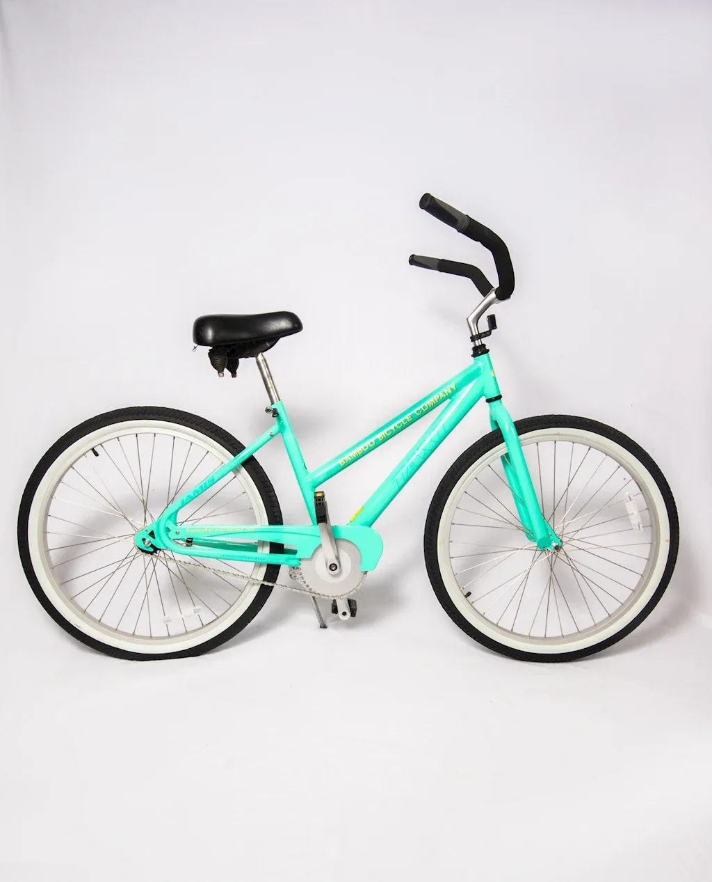 Turquoise rental bicycle branded Bamboo Bicycle Company.