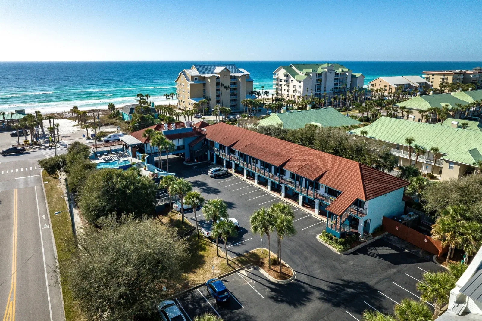 Aerial view of Beachside Inn across Scenic Highway 98 from the Gulf in Destin.